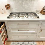 Cooktop stove on a white painted 3 drawer base