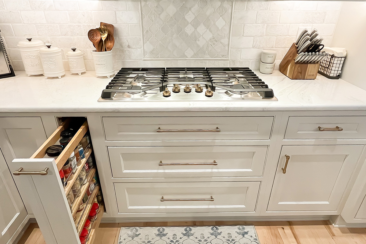 Cooktop stove on a white painted 3 drawer base