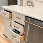 Drawers pulled out of painted cabinets