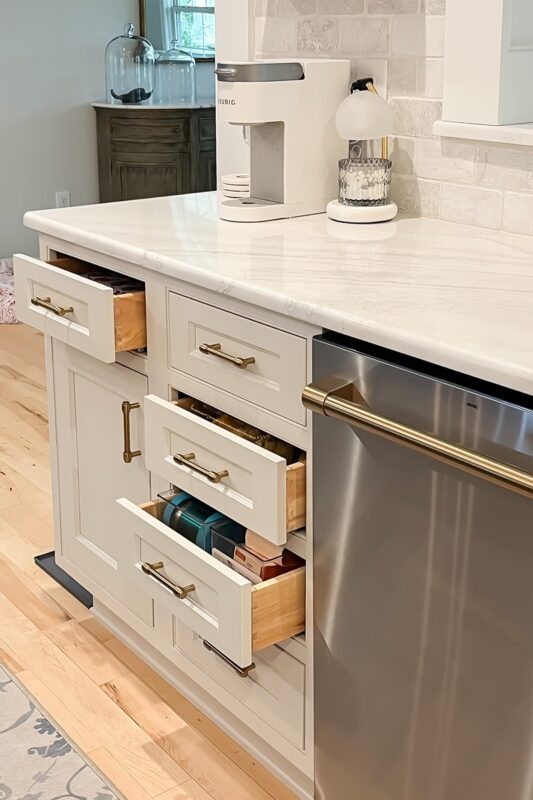 Drawers pulled out of painted cabinets