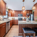 Cherry stained kitchen cabinets