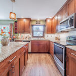 Cherry stained kitchen cabinets