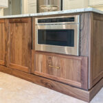 Walnut island with in-cabinet microwave