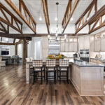 Light stained kitchen cabinets with exposed beams
