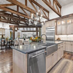 Light stained kitchen cabinets with exposed beams