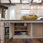 Light stained kitchen cabinets with exposed beams