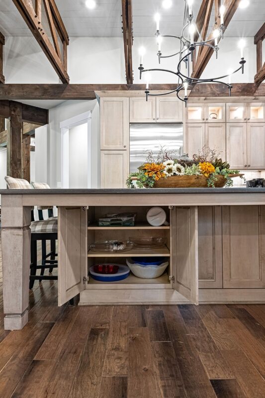 Light stained kitchen cabinets with exposed beams