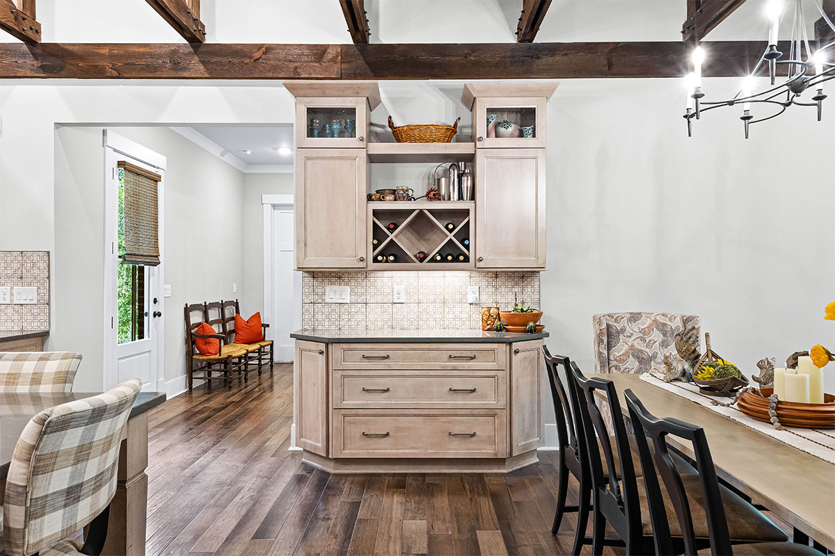 Light stained kitchen cabinets with exposed beams