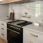 Painted kitchen cabinets with black stove