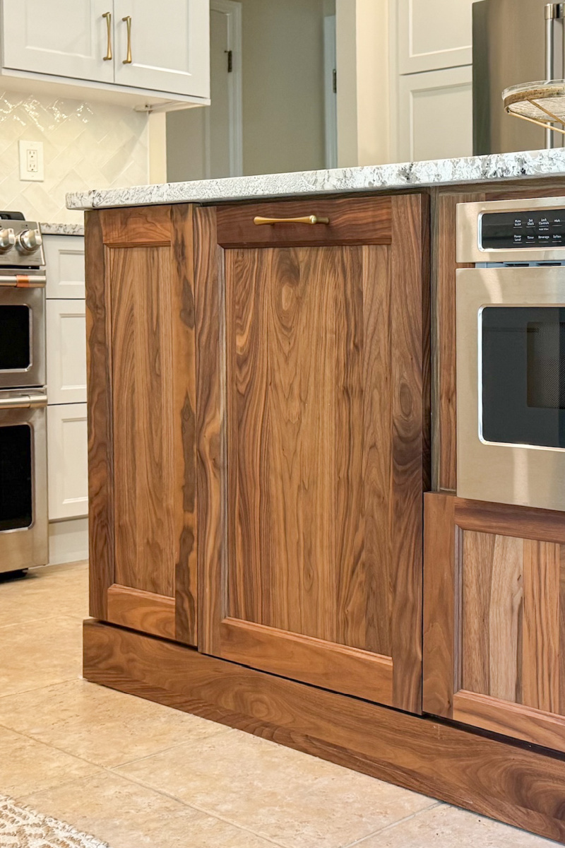 Stained kitchen island cabinet showing a matte sheen finish.