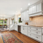 White painted kitchen with wood floors