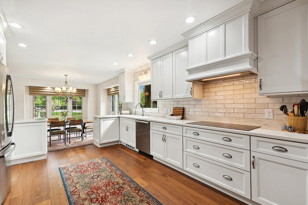 White painted kitchen with wood floors