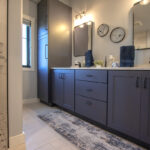 Bathroom with vanity cabinets painted in Hale Navy color.