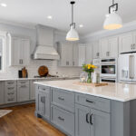 Painted gray kitchen cabinets and island.