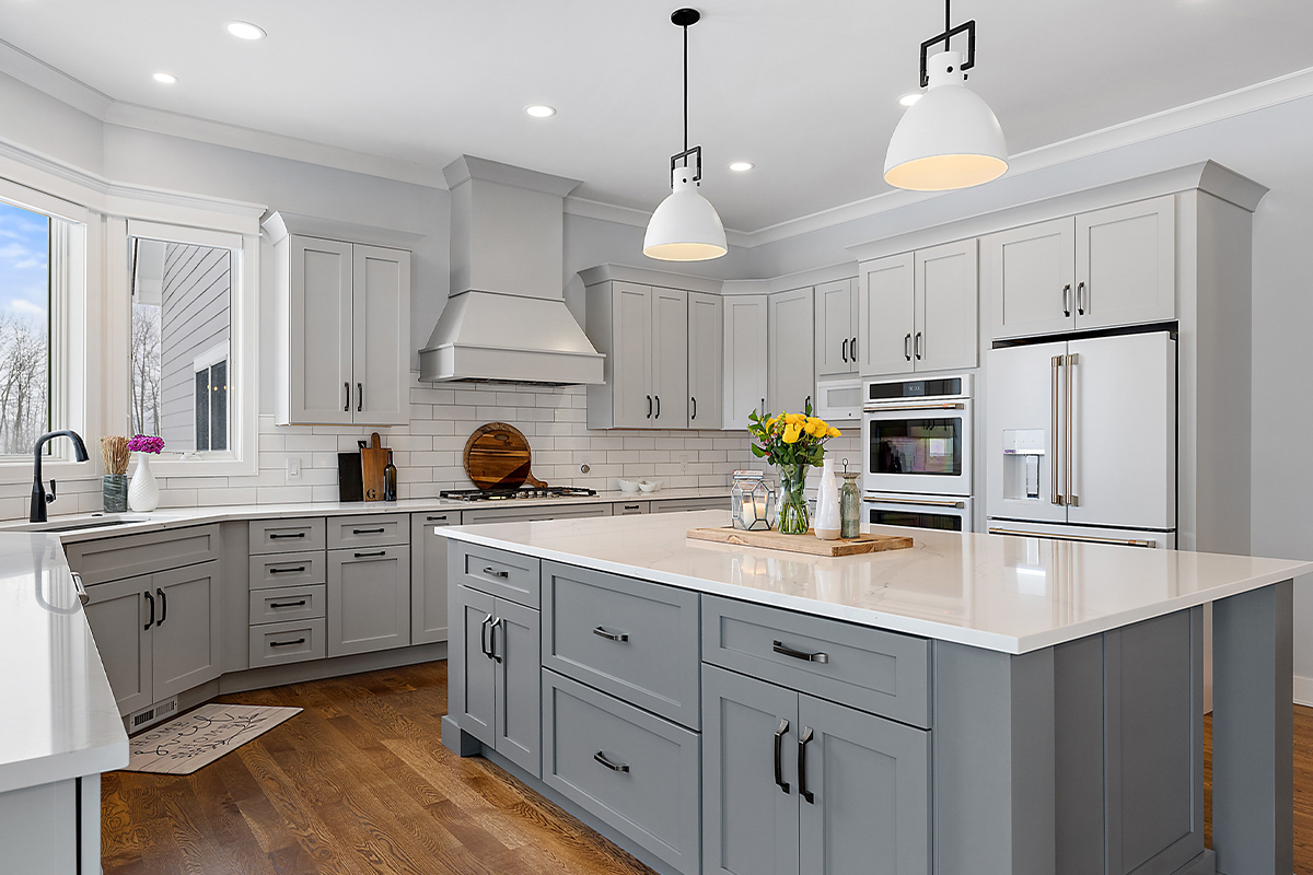 Painted gray kitchen cabinets and island.