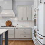 Painted gray kitchen cabinets and island.