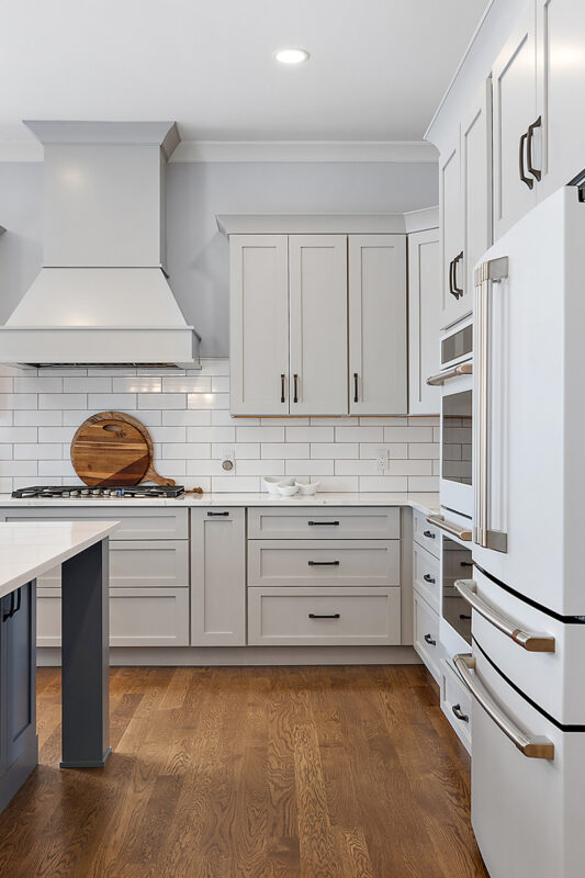 Painted gray kitchen cabinets and island.