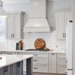 Painted gray kitchen cabinets and island.