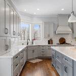 Painted gray kitchen cabinets and island.