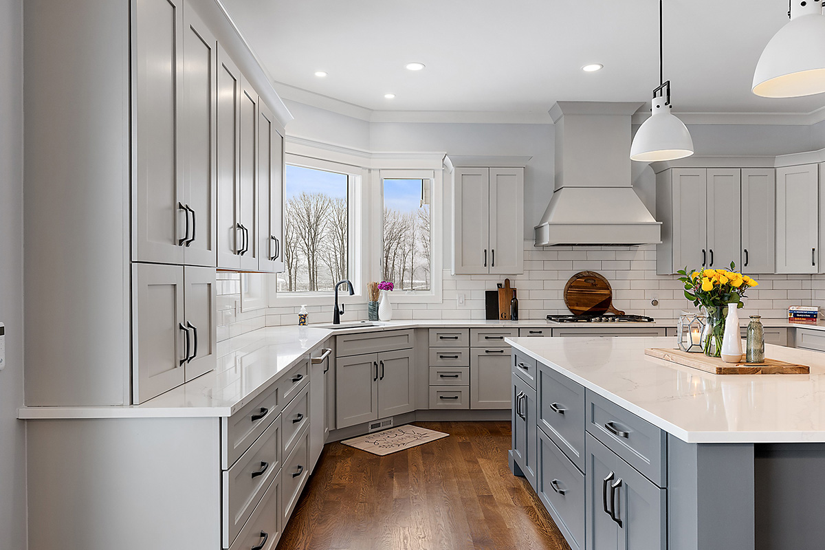 Painted gray kitchen cabinets and island.