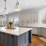 Painted gray kitchen cabinets and island.