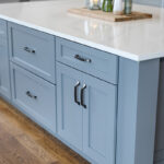 Painted gray kitchen cabinets and island.