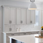 Painted gray kitchen cabinets and island.