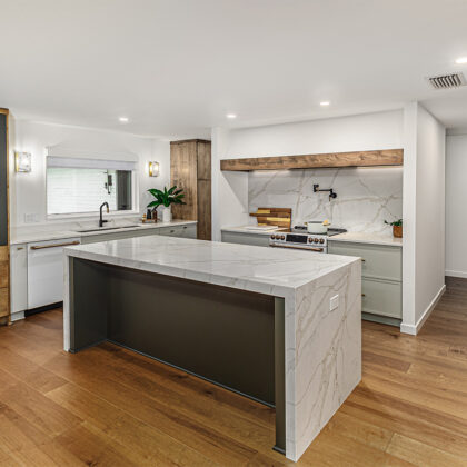 Multi-color kitchen with two-tone hutch, painted cabinets with stained accents.