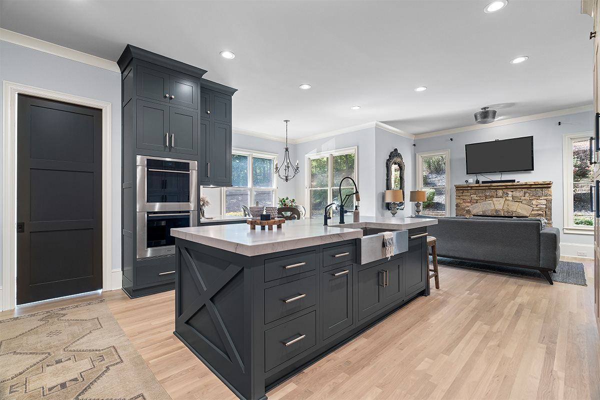 Light stained perimeter kitchen cabinets and Graphite painted island and hood.