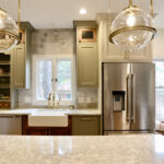 Painted green kitchen cabinets.