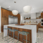 Mid-century modern kitchen in walnut natural cabinetry.