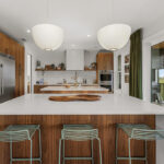 Mid-century modern kitchen in walnut natural cabinetry.