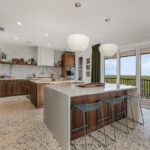 Mid-century modern kitchen in walnut natural cabinetry.
