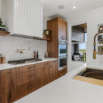 Mid-century modern kitchen in walnut natural cabinetry.