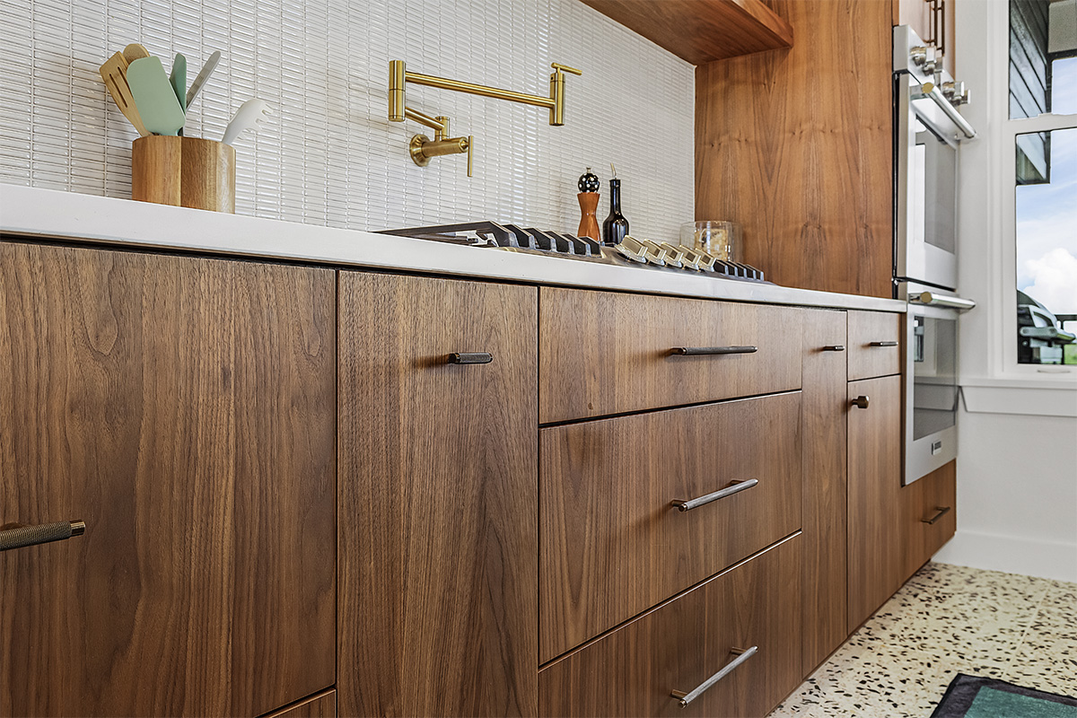 Mid-century modern kitchen in walnut natural cabinetry.