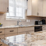 Light maple kitchen perimeter cabinets.