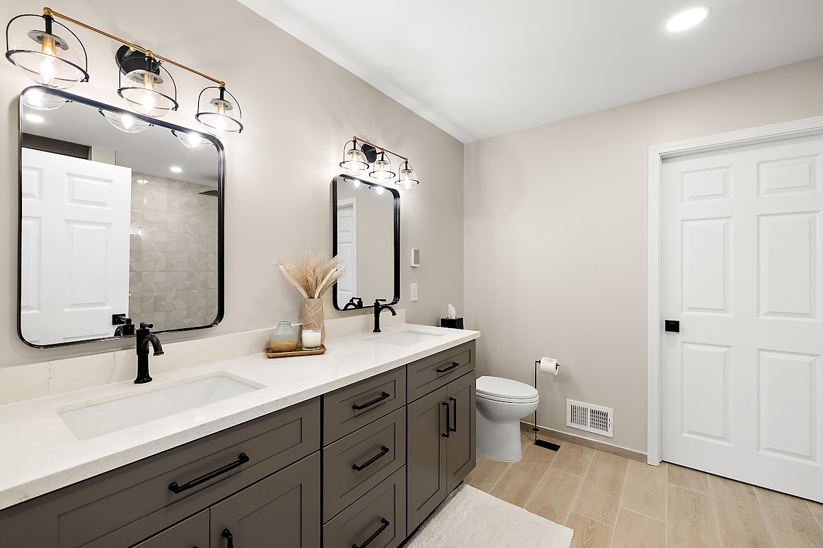Gray bathroom vanity with 2 sinks and mirrors