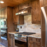 Rustic hickory kithen cabinets with brown stain