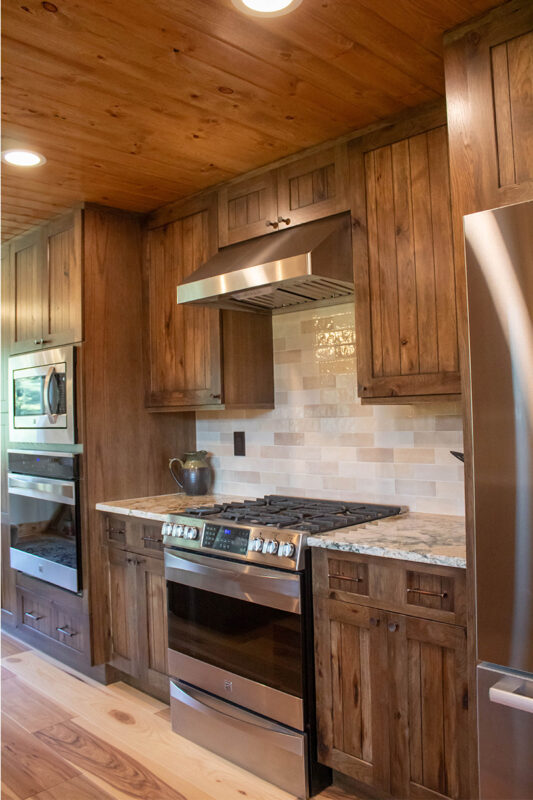 Rustic hickory kithen cabinets with brown stain