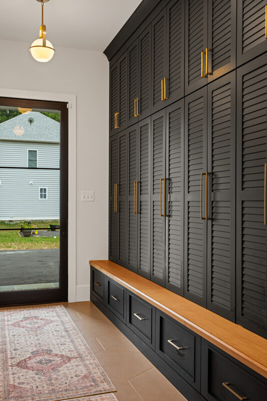 Dark stained mudroom storage cabinets