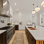 Kitchen with painted white and dark stained cabinets