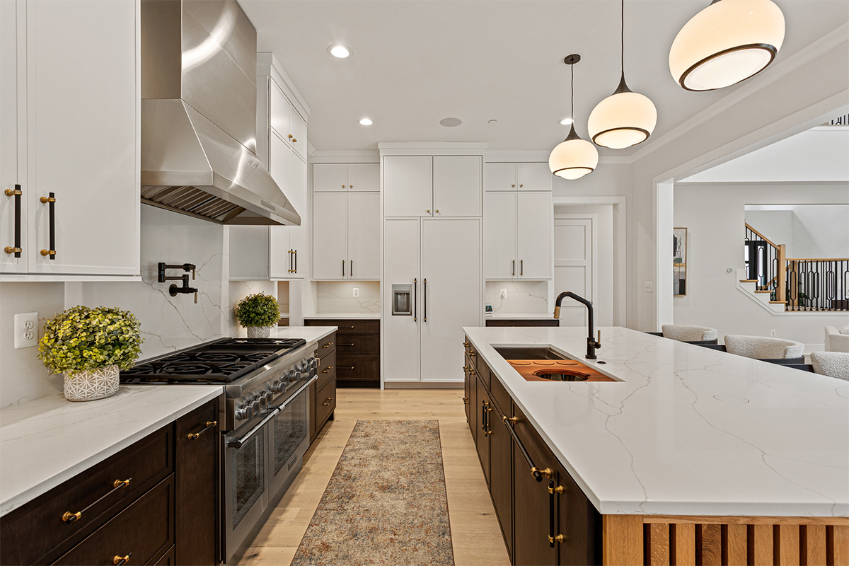 Kitchen with painted white and dark stained cabinets