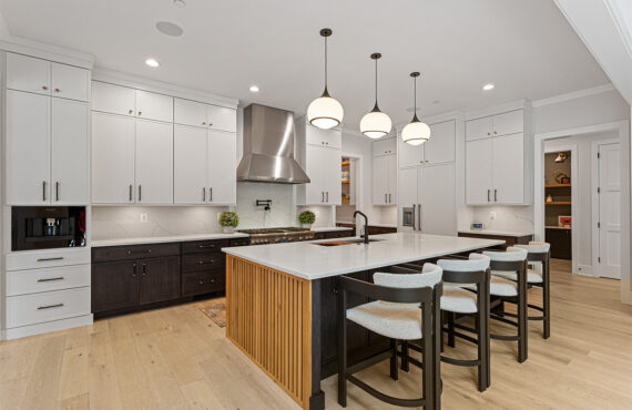 Kitchen with painted white and dark stained cabinets