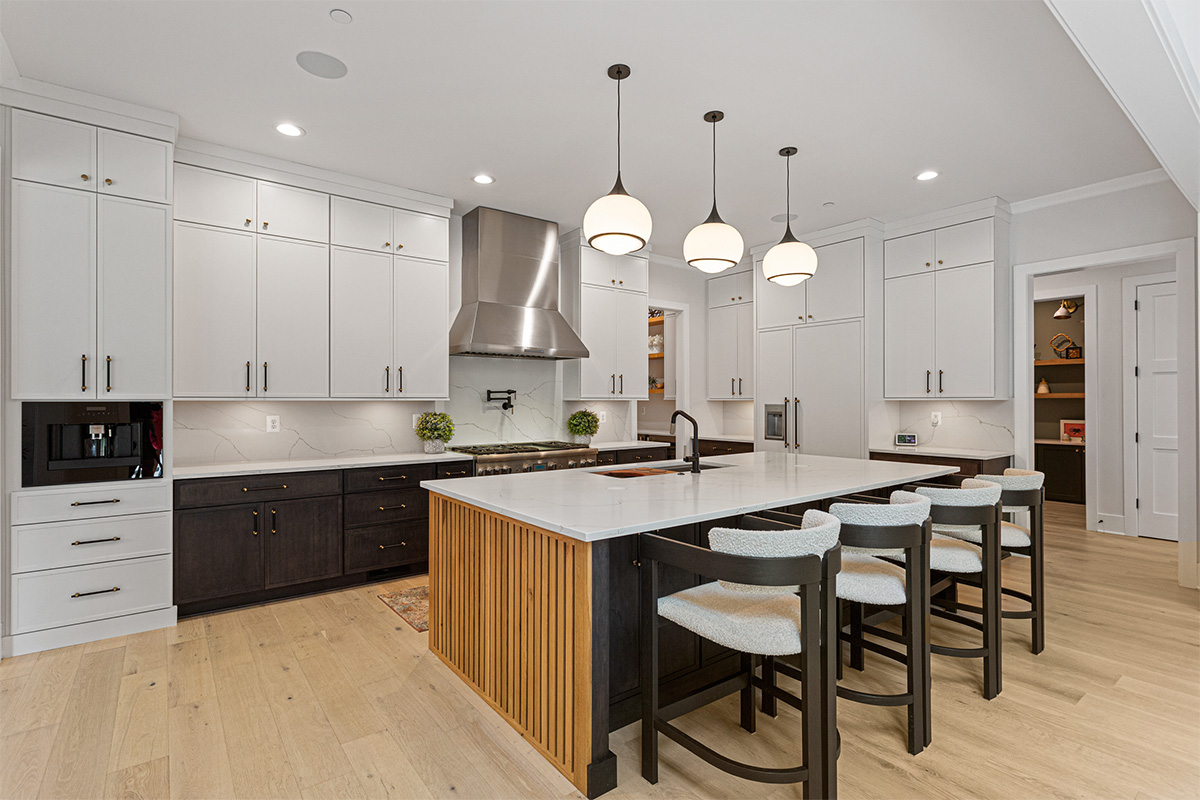 Kitchen with painted white and dark stained cabinets