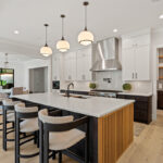 Kitchen with painted white and dark stained cabinets