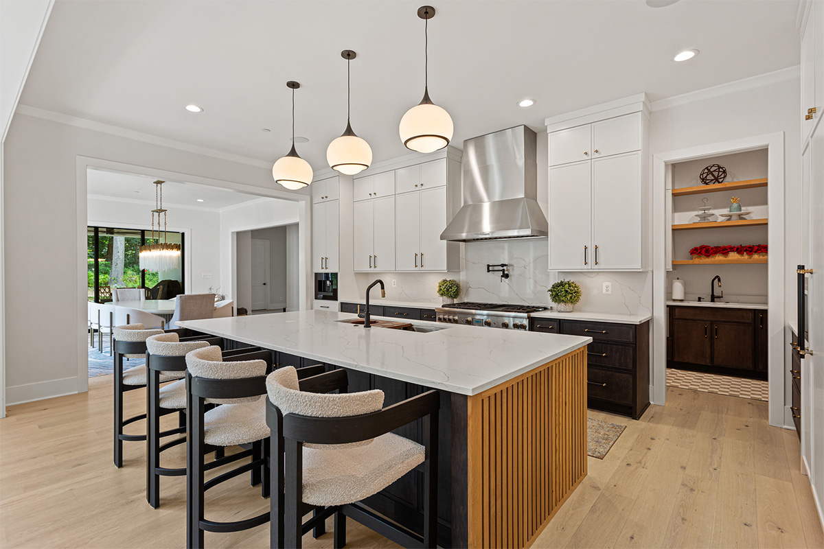 Kitchen with painted white and dark stained cabinets