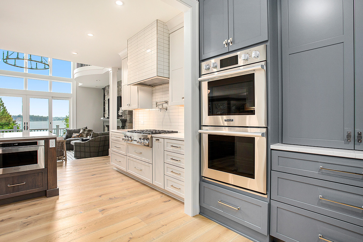 Blue pantry looking into the white kitchen cabinets