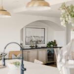 kitchen with painted island and stained perimeter.
