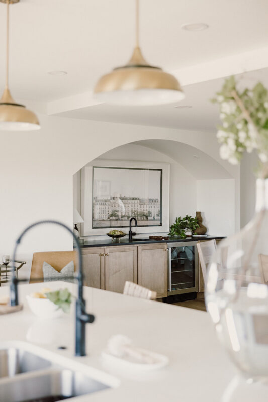 kitchen with painted island and stained perimeter.