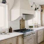 kitchen with painted island and stained perimeter.